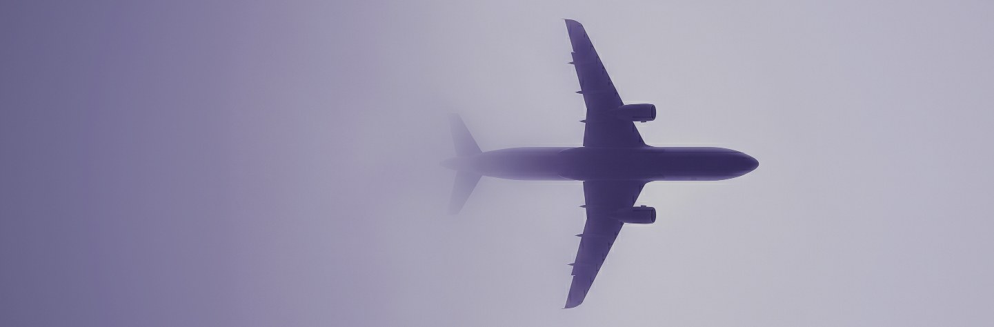Aircraft in flight above clouds